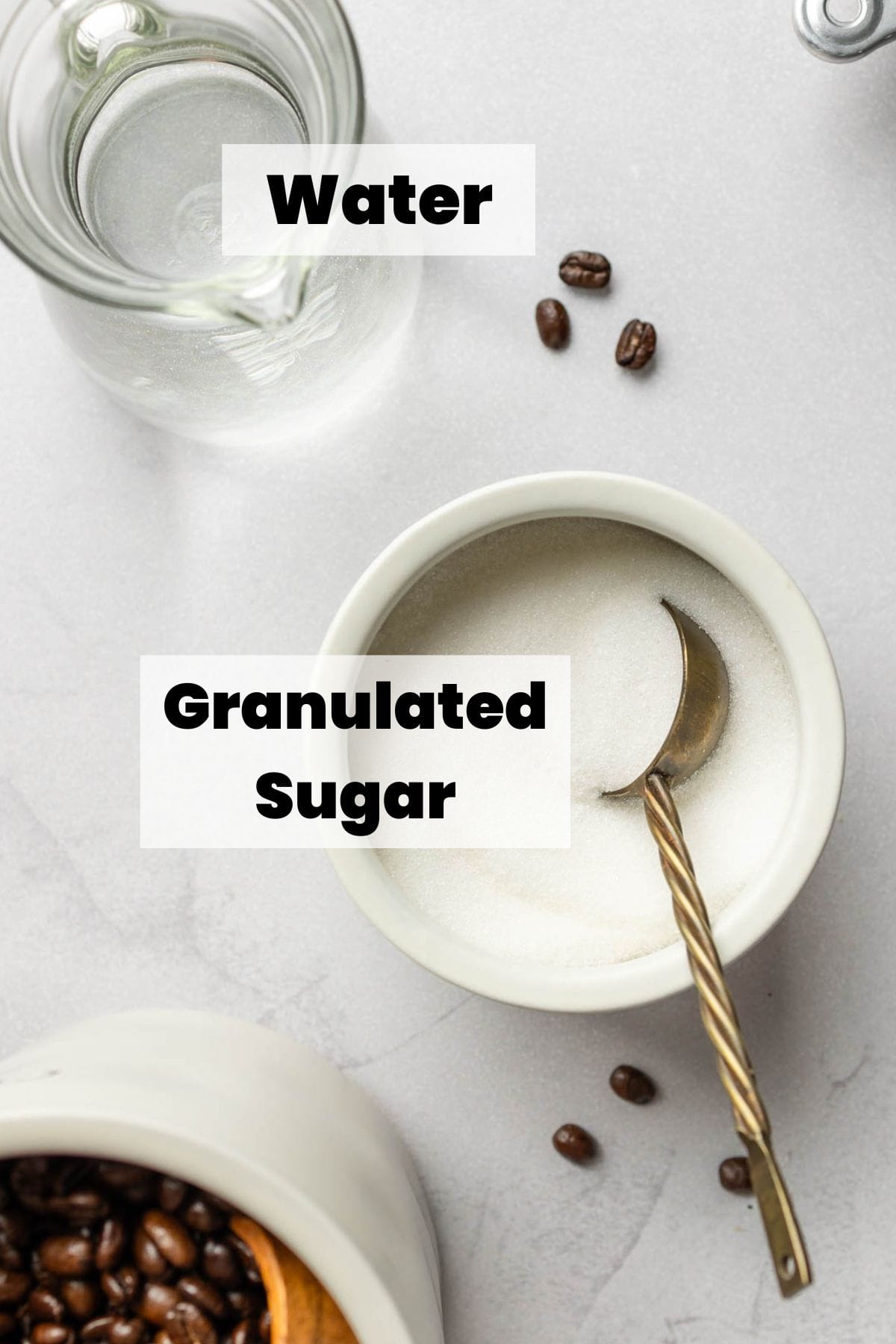 Granulated sugar and water measured out in cups.