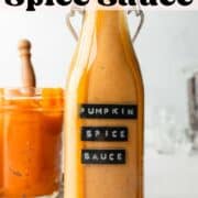 Pumpkin spice sauce in glass bottle, drizzling down the side.