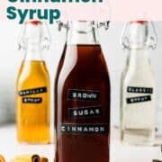 Brown sugar cinnamon syrup in glass bottle with red swing top lid.