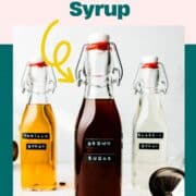 Brown sugar syrup in swing top bottle next to other syrups in bottles.