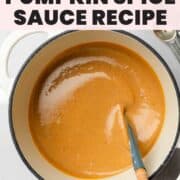 Smooth pumpkin spice sauce in pan stirred by hand.