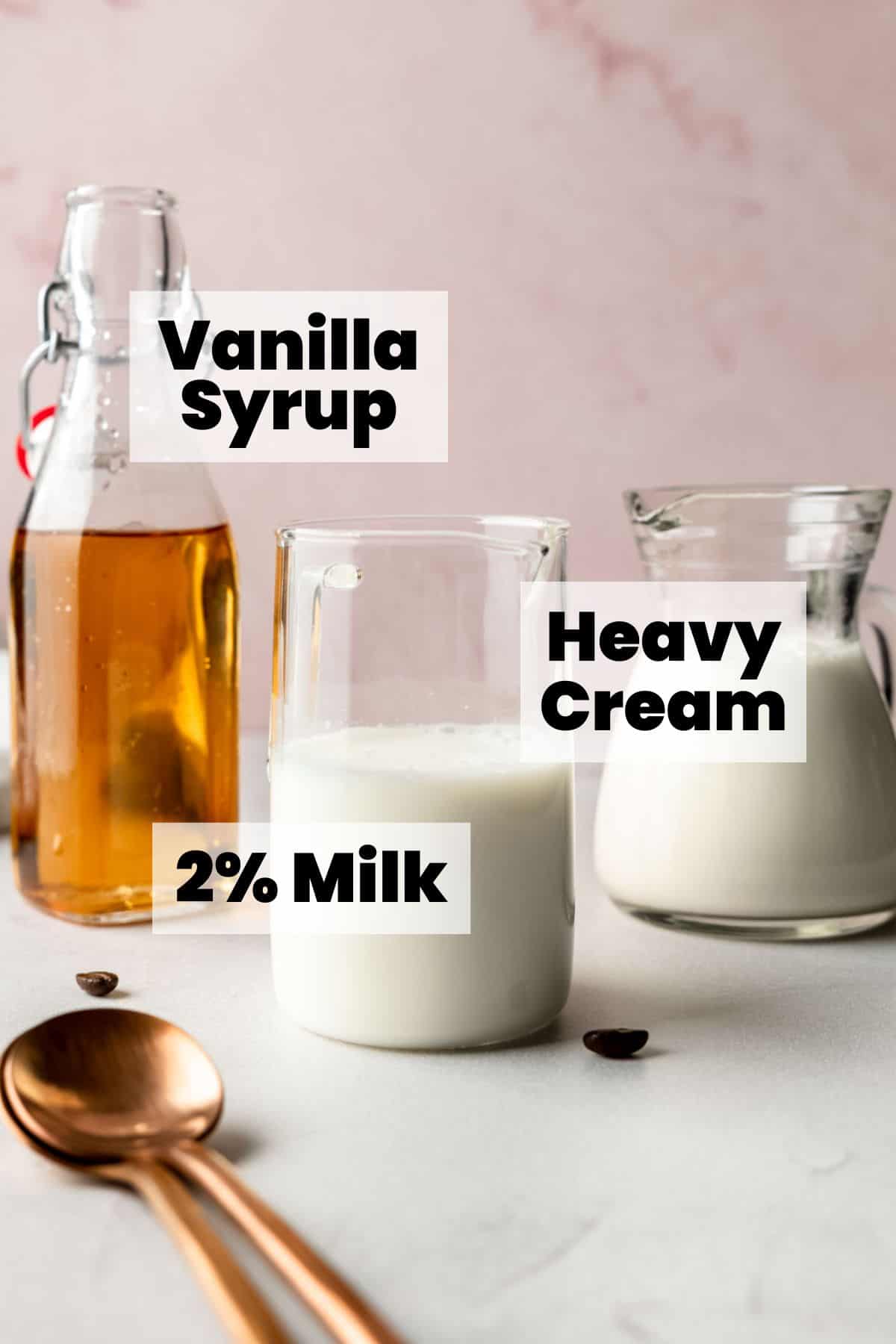 Labeled ingredients for homemade vanilla sweet cream: vanilla syrup, 2% milk, and heavy cream.