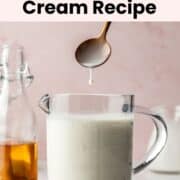 A spoon lifted above the prepared sweet cream mixture, with a drop falling back into the glass measuring cup.